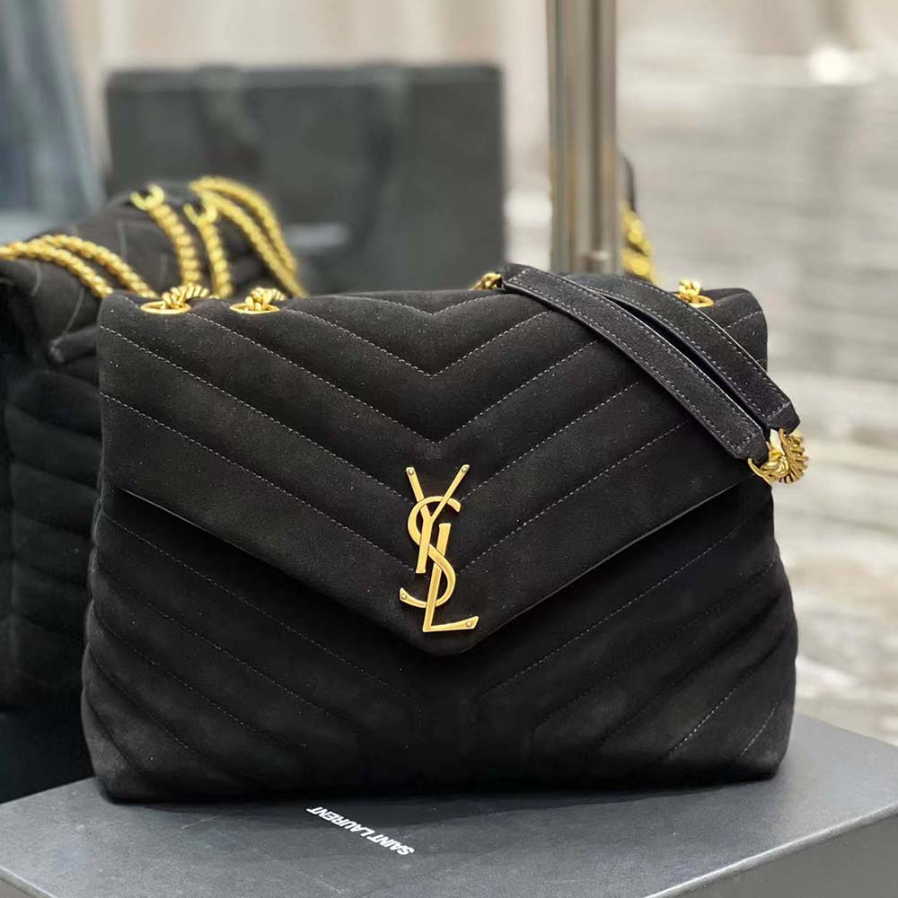Close-up of gold YSL logo hardware on Loulou Medium shoulder bag