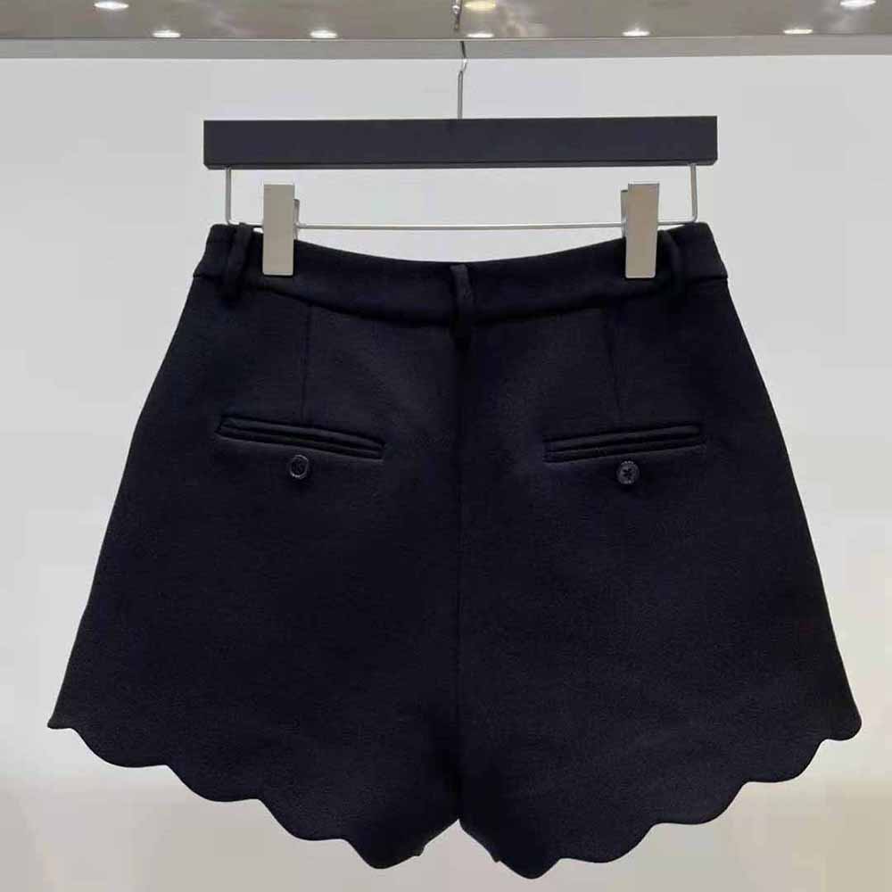 Side angle showing tailored fit of Saint Laurent YSL Women Mini Shorts