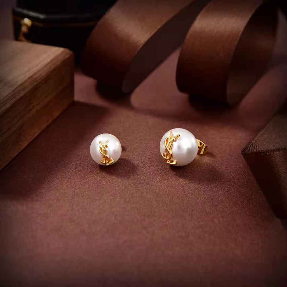 Side angle showing pearl and metal design in YSL earrings