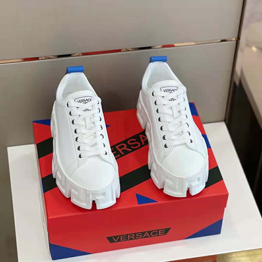 Close-up of blue leather and Greca labyrinth sole on Versace unisex sneakers
