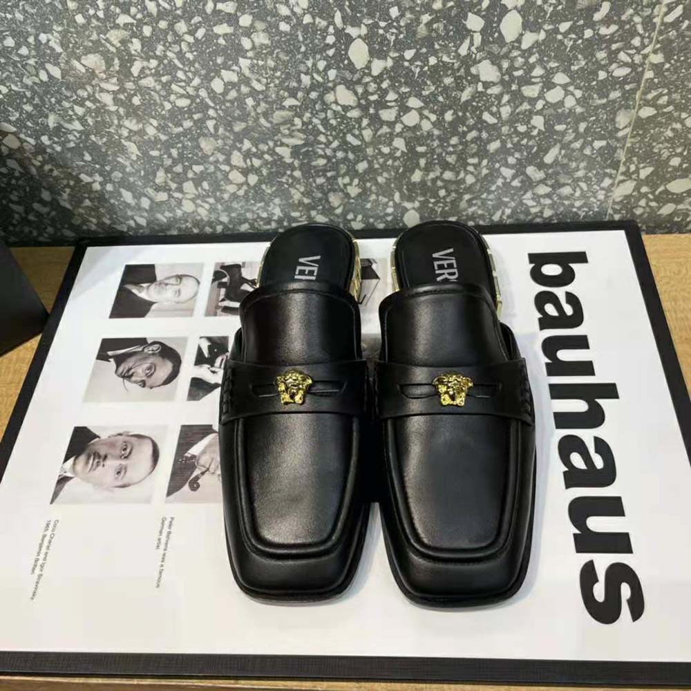 Close-up of gold Medusa emblem on Versace Women La Medusa Loafers
