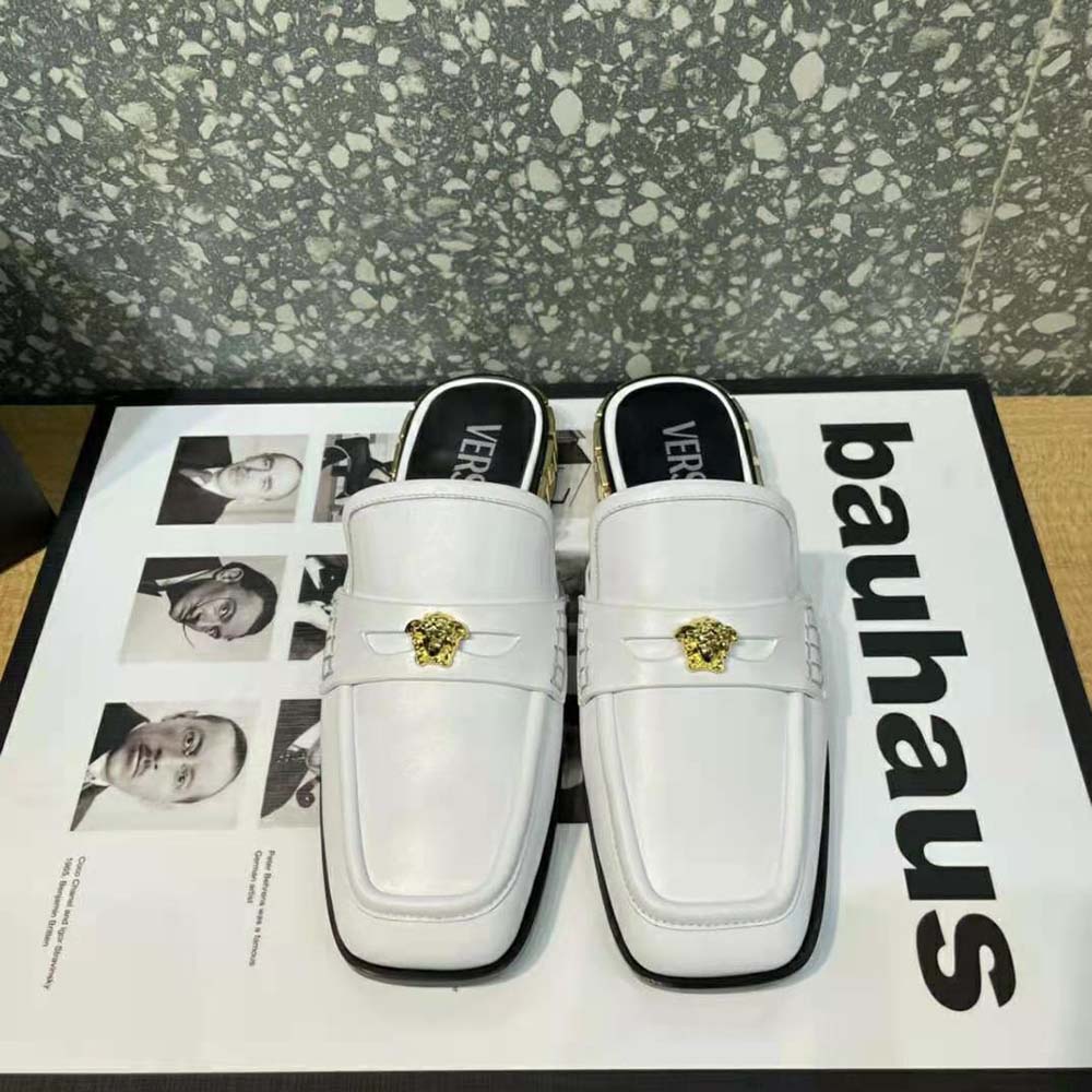 Close-up of gold Medusa emblem on Versace Women La Medusa Loafers