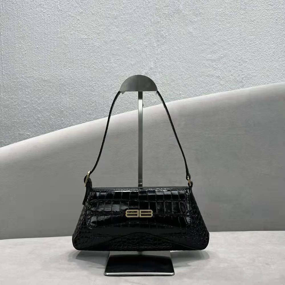 Side angle showing flap closure and silver hardware on Balenciaga XX Small Bag