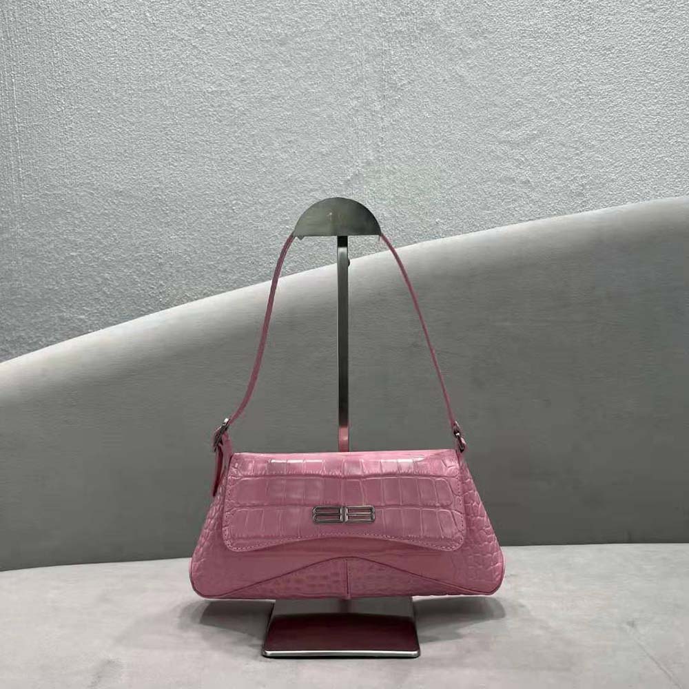Side view showing flap closure and silver hardware on Balenciaga XX Small Flap Bag