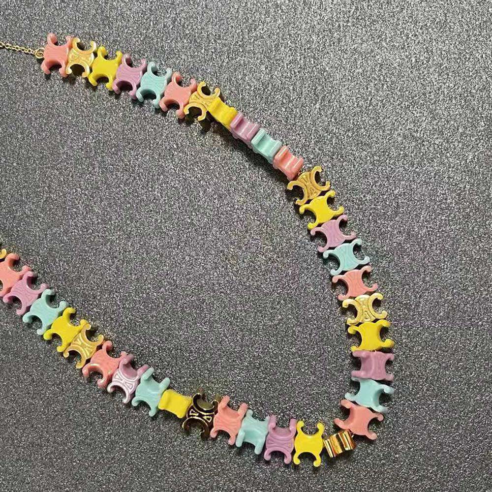 Full view of Celine Women Baby Necklace highlighting yellow gold tone