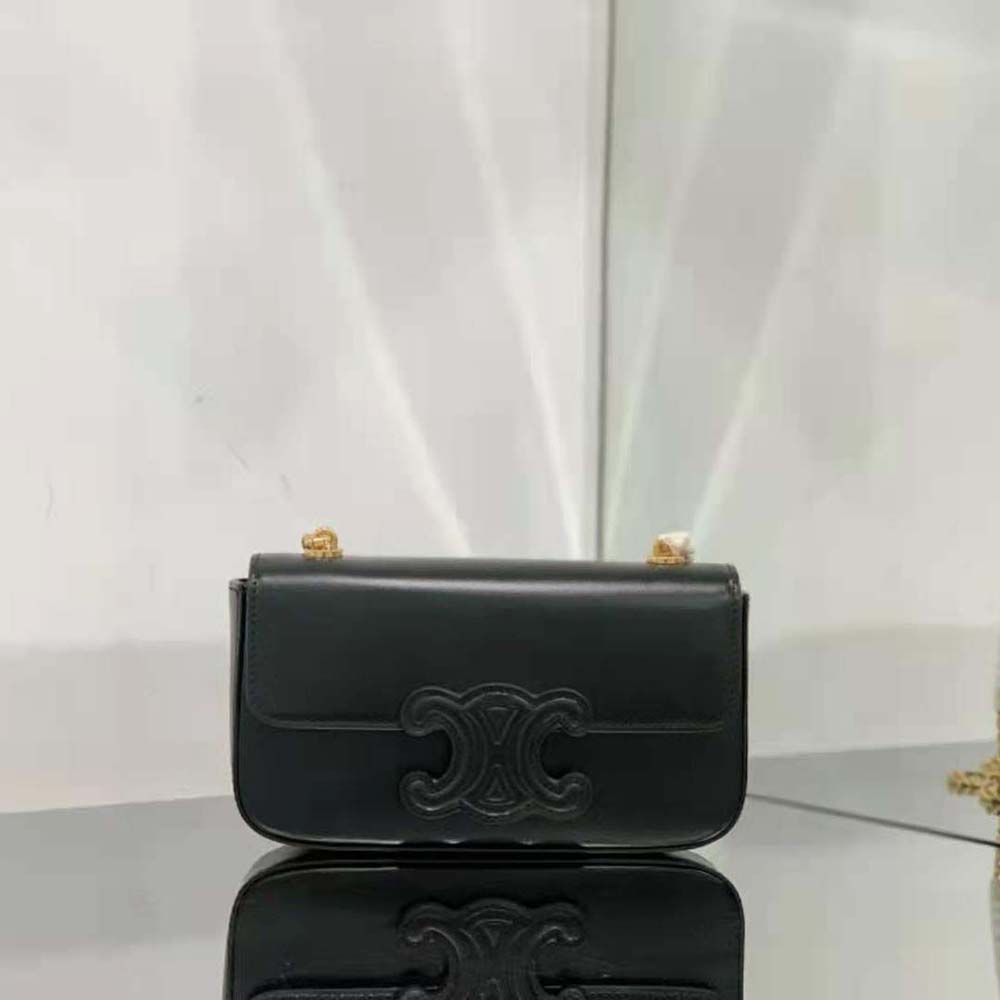 Close-up of gold-tone Triomphe chain on Celine shoulder bag