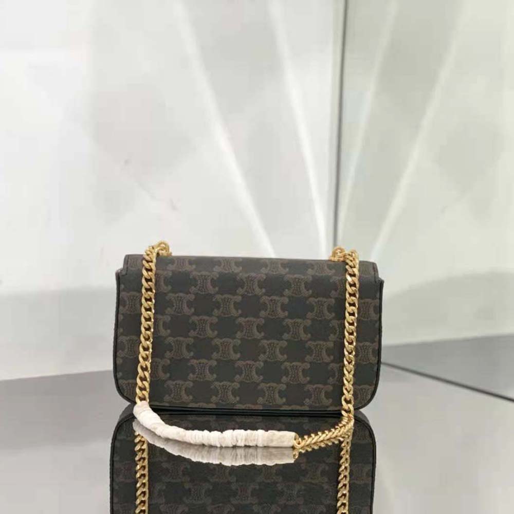 Side view showing Triomphe canvas and calfskin trim on the bag