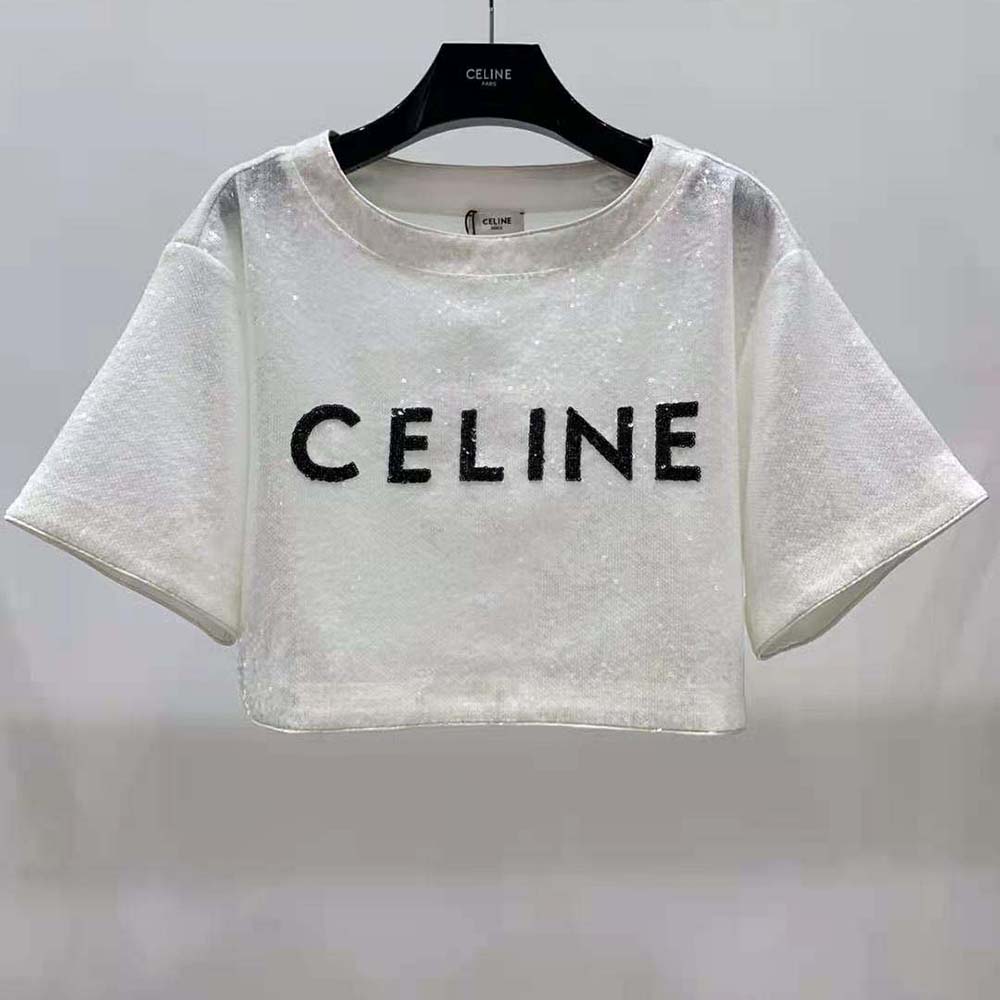 Close-up of delicate embroidered Celine logo on white cotton jersey T-shirt