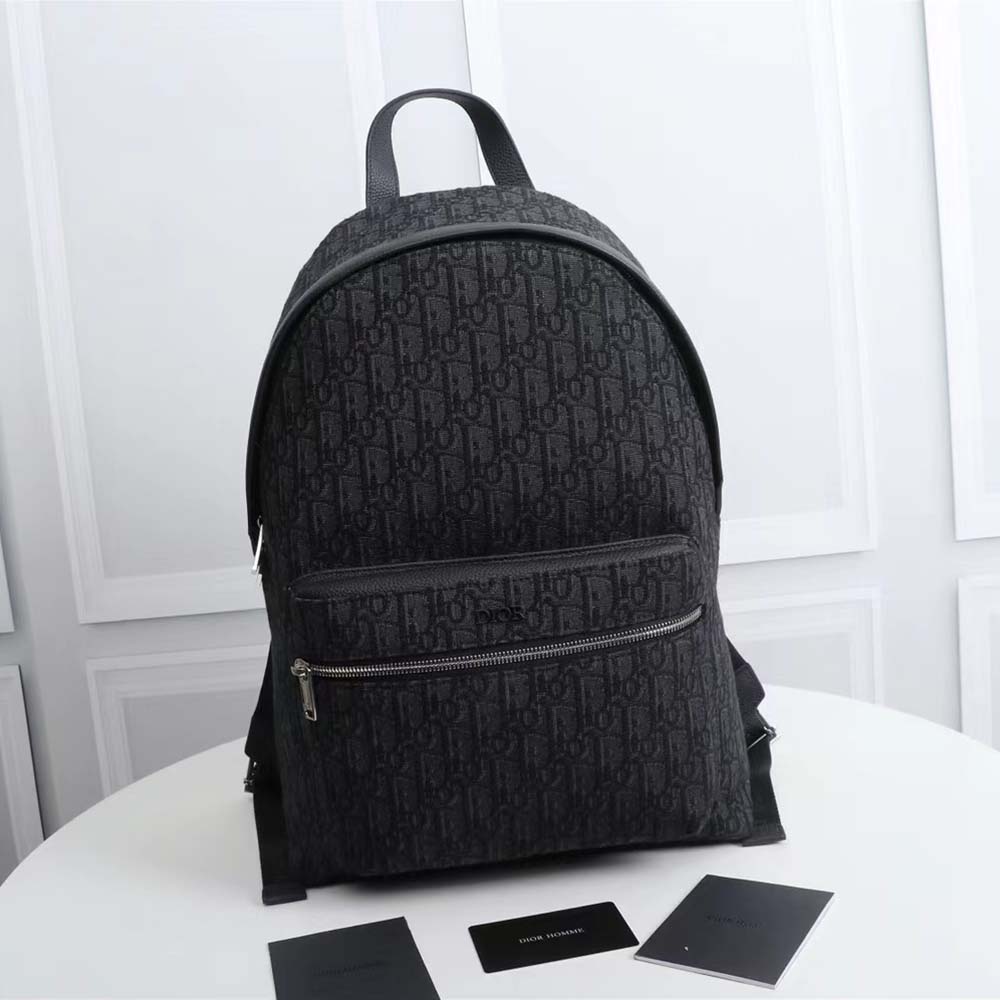 Close-up of black oblique jacquard fabric and gunmetal hardware detail