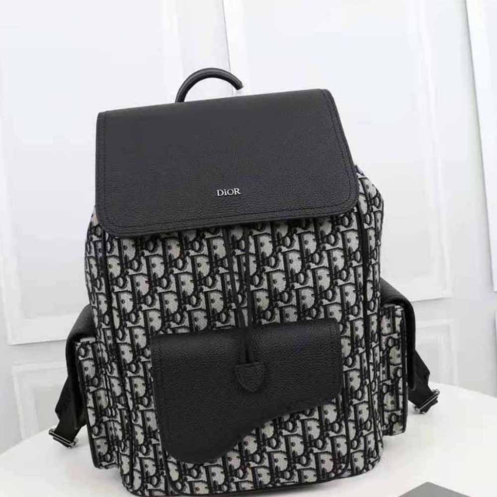Close-up detail of black grained calfskin on Dior Men Saddle Backpack