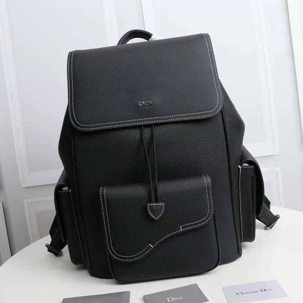 Close-up of black grained calfskin texture on Dior Men Saddle Backpack