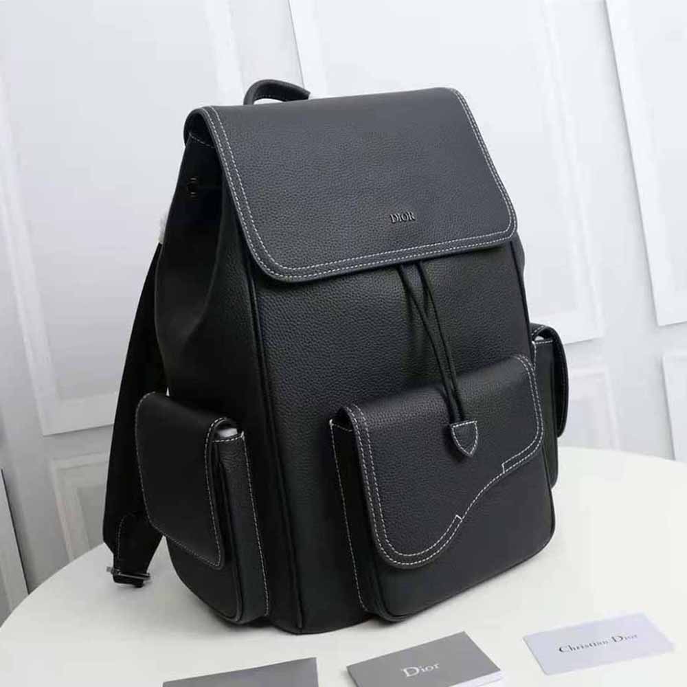 Side profile showing silver-tone hardware on Dior Men Saddle Backpack
