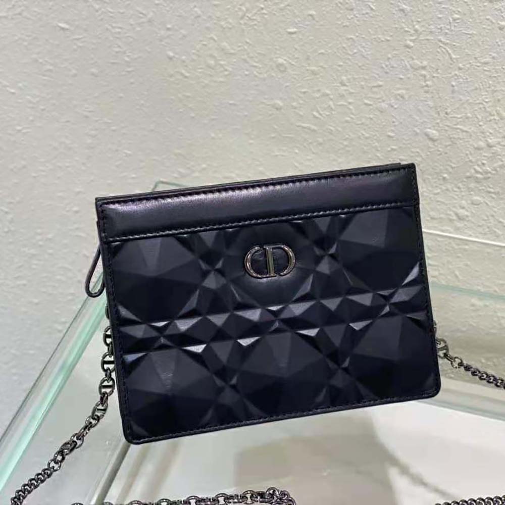 Side angle showing zipped closure and chain strap on Dior pouch