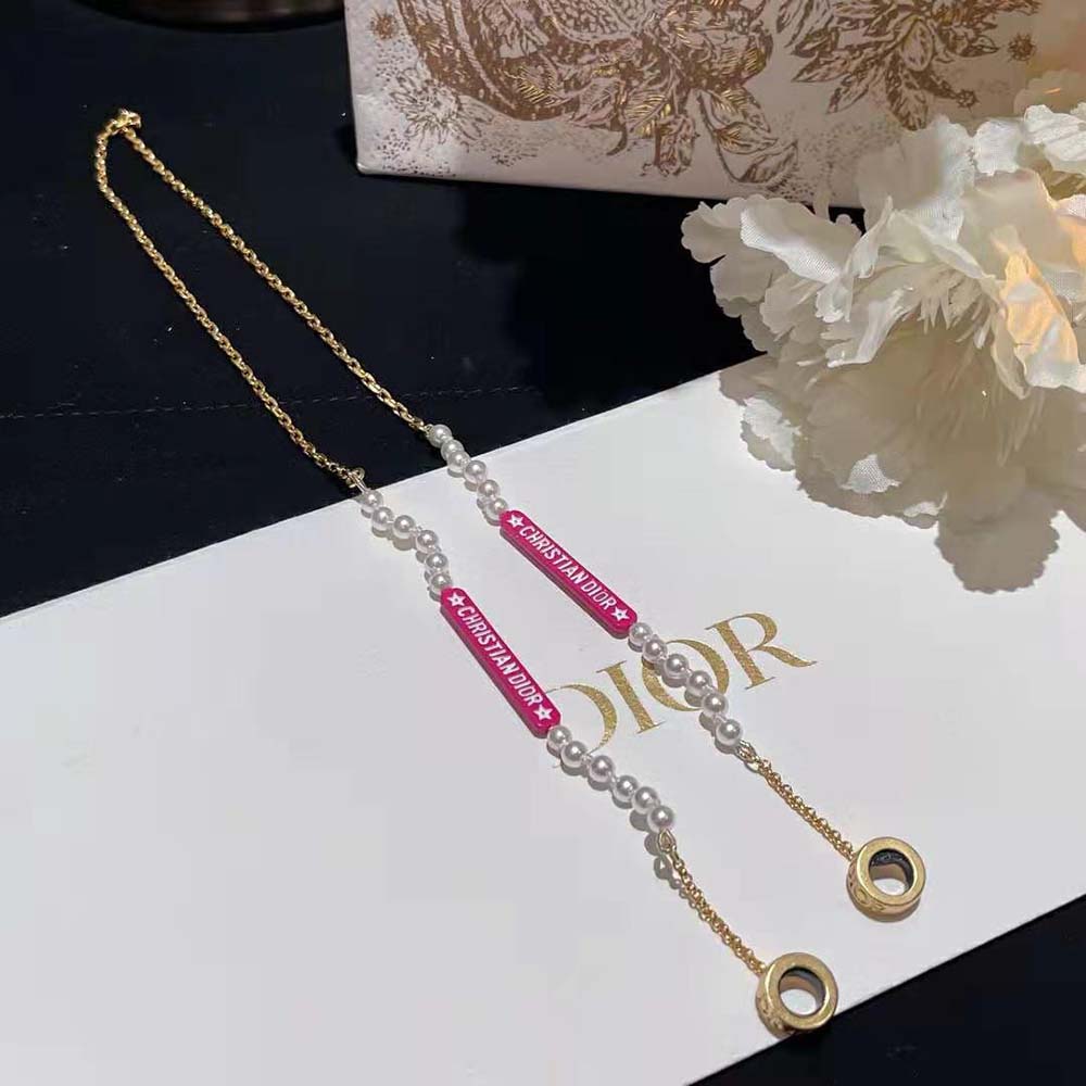 Side angle highlighting signature headphone pendant on Dior Women D-Vibe Necklace