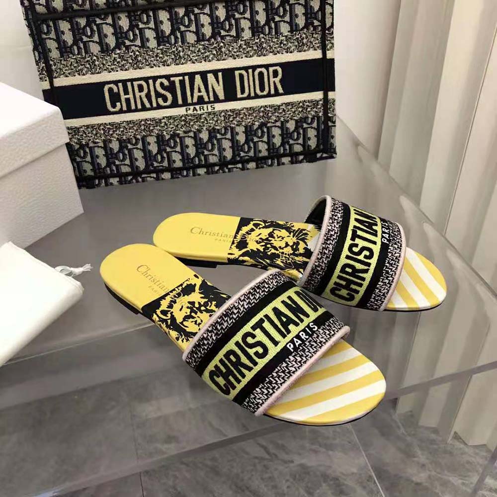 Top-down view of bright yellow Dior Women Dway Slide with pink embroidery