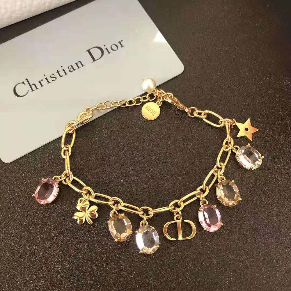 Side angle showcasing clasp and gold-finish metal on Dior jewelry