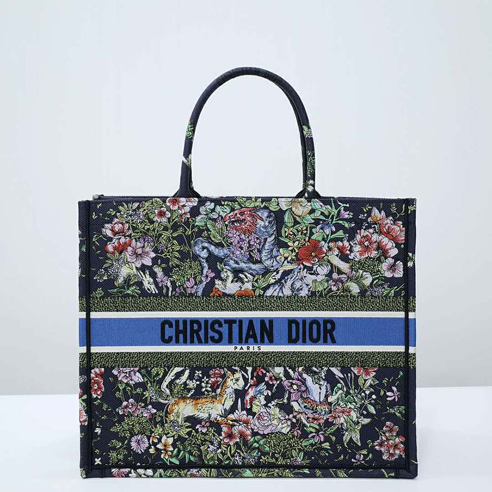 Close-up detail of blue canvas and D-Constellation embroidery on Dior tote