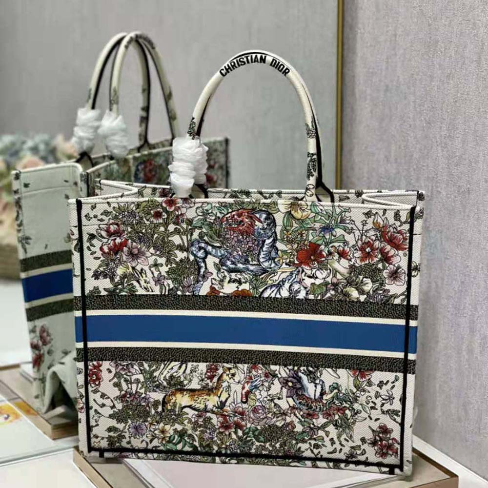 Side angle showing spacious silhouette of Dior Women Large Dior Book Tote in blue