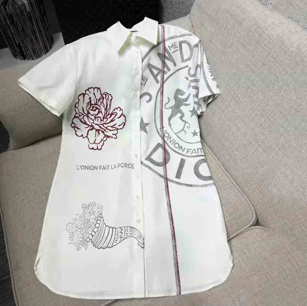 Close-up detail of Dior Union motif embroidery on blouse sleeve