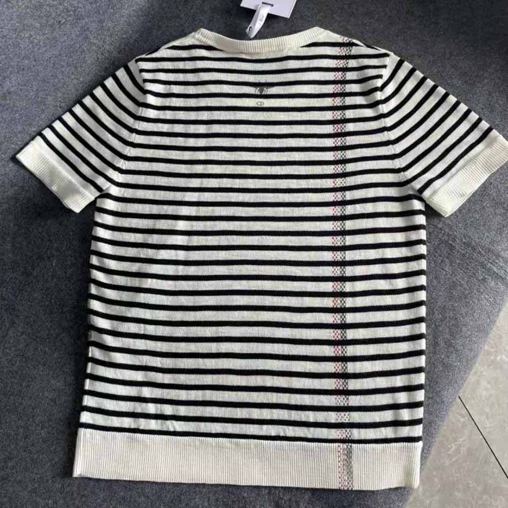 Side profile showing silhouette and marinière detail of Dior sweater