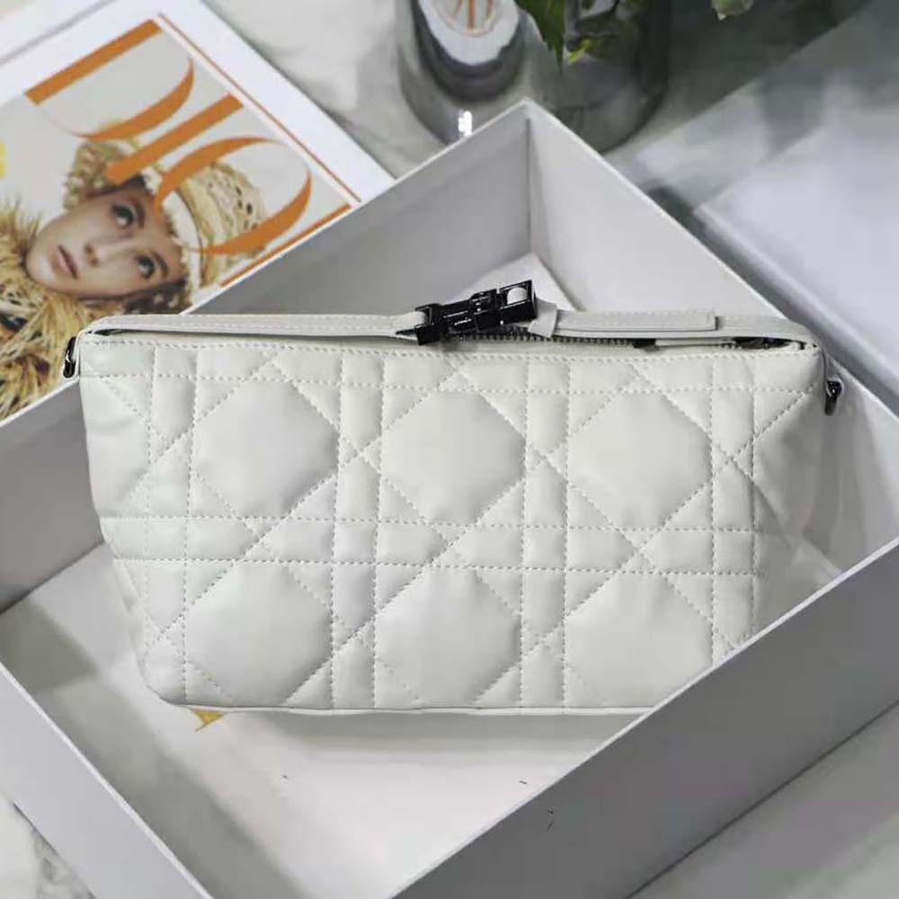 Side angle showing silver-tone hardware on Dior Nomad Pouch