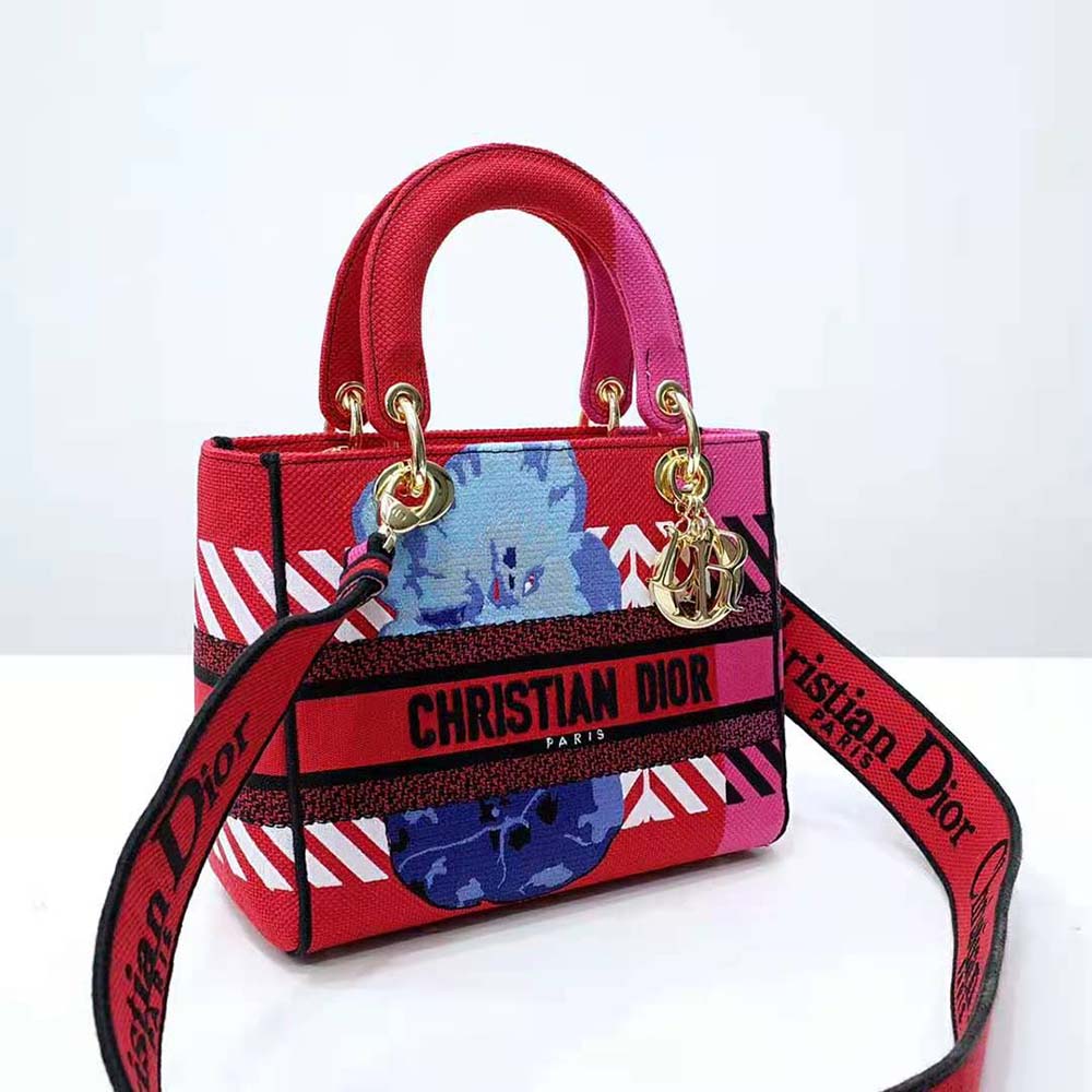 Side angle showing silver-tone hardware and zip closure on Dior Women Medium Lady D-lite Bag