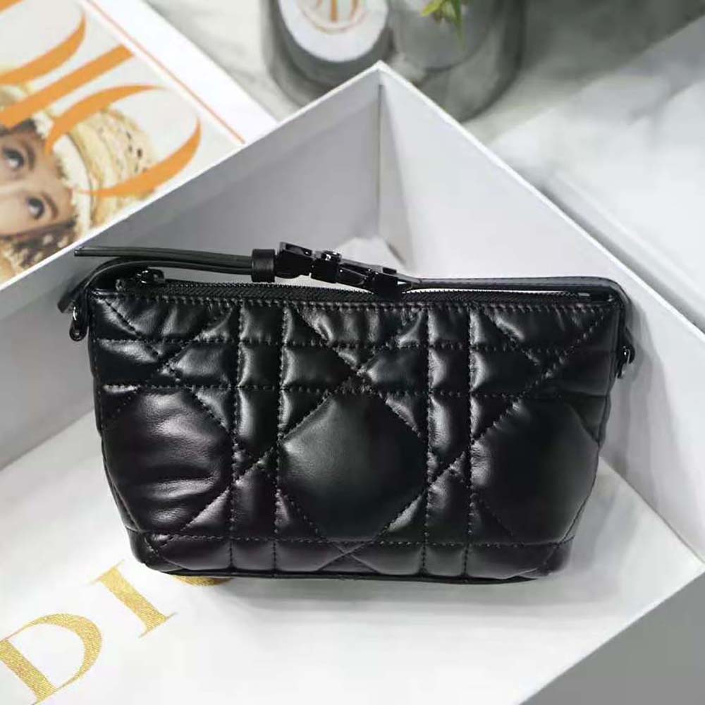 Close-up of black macrocannage stitching on Dior Women Small Diortravel Nomad Pouch