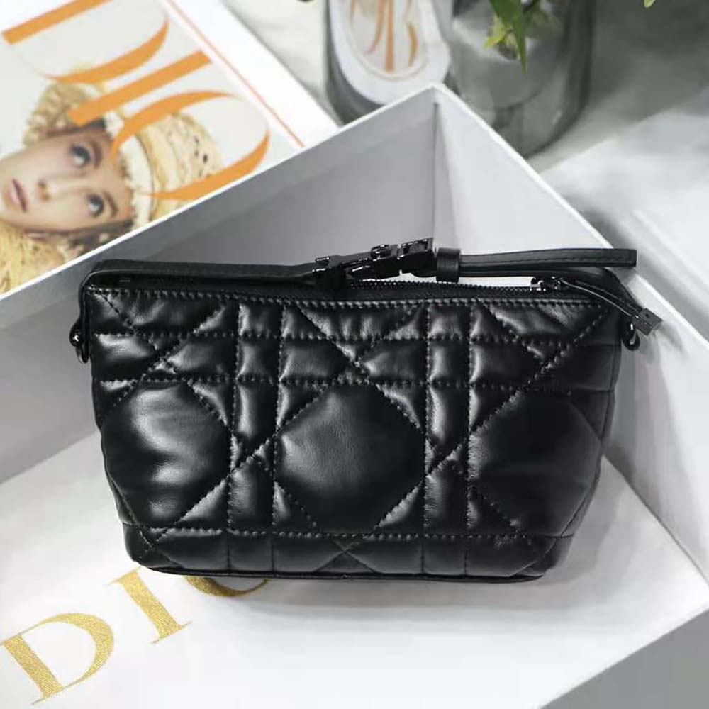 Side angle showing silver hardware detail on Dior Women Small Diortravel Nomad Pouch