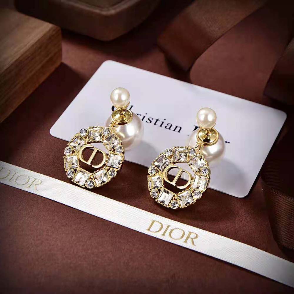 Side angle showing gold finish and white resin pearls on Dior Women Tribales Earrings