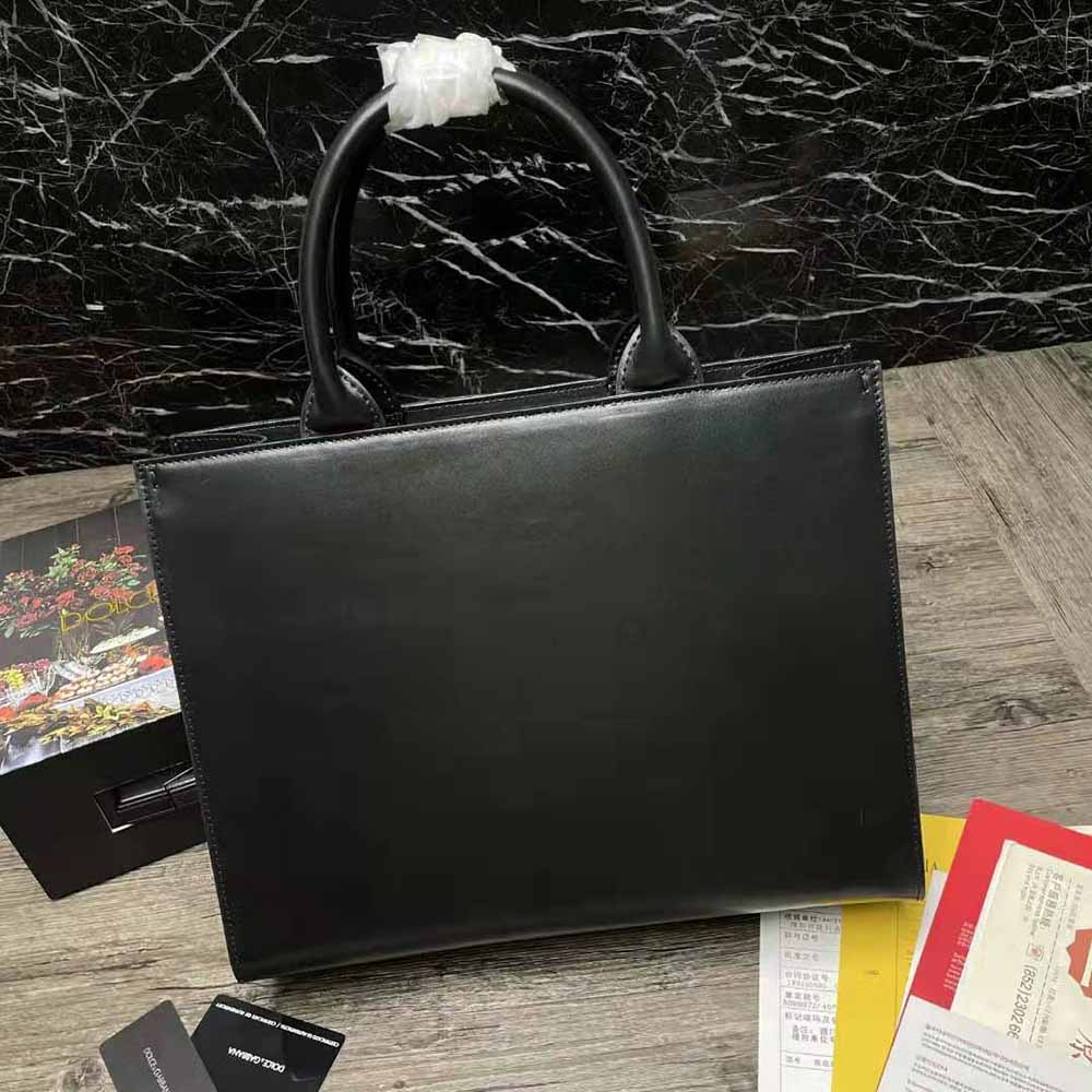 Side profile showing silhouette of Dolce Gabbana D&G Women Small Calfskin DG Daily Shopper-Black