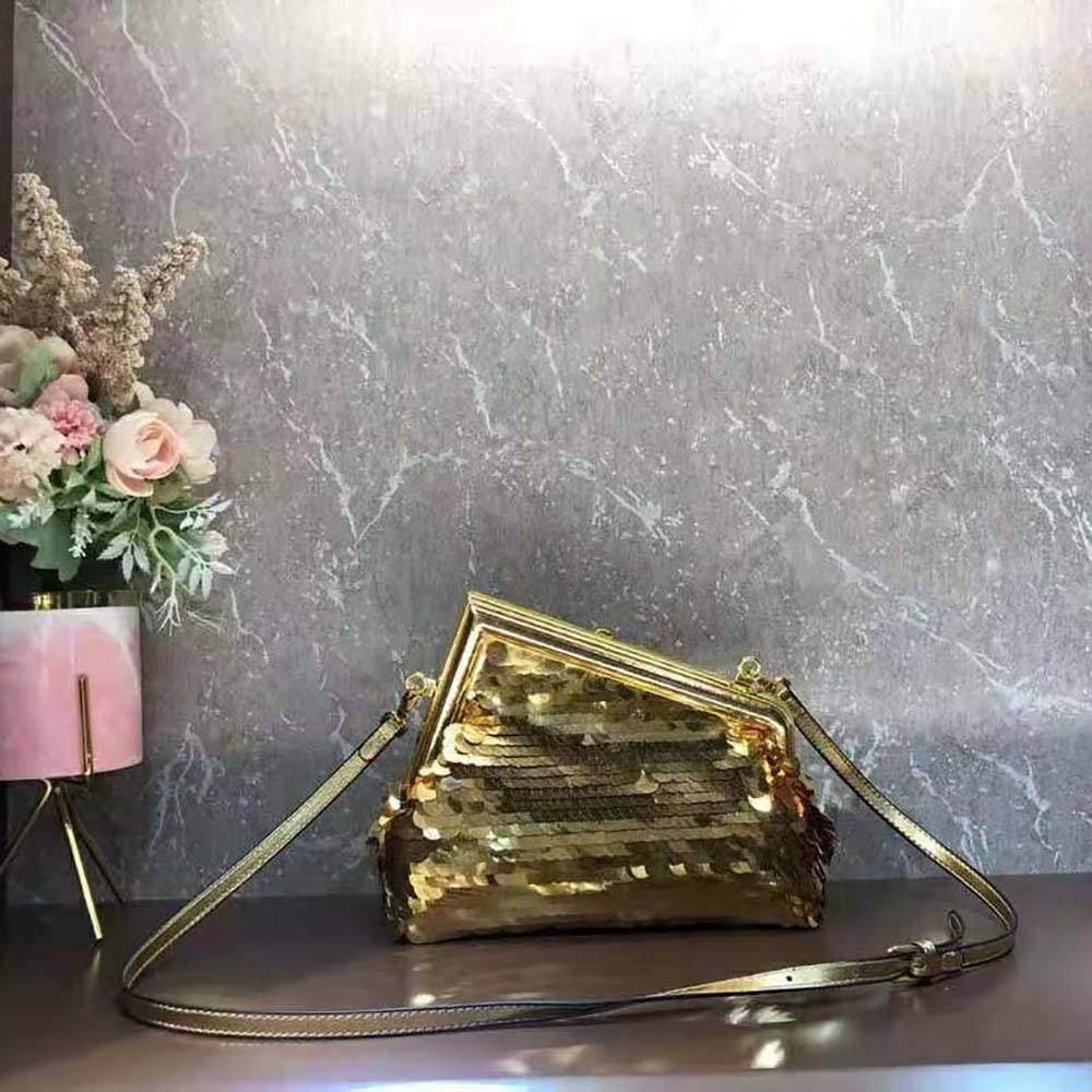 Side angle showing structured shape and gold hardware of Fendi Women First Bag