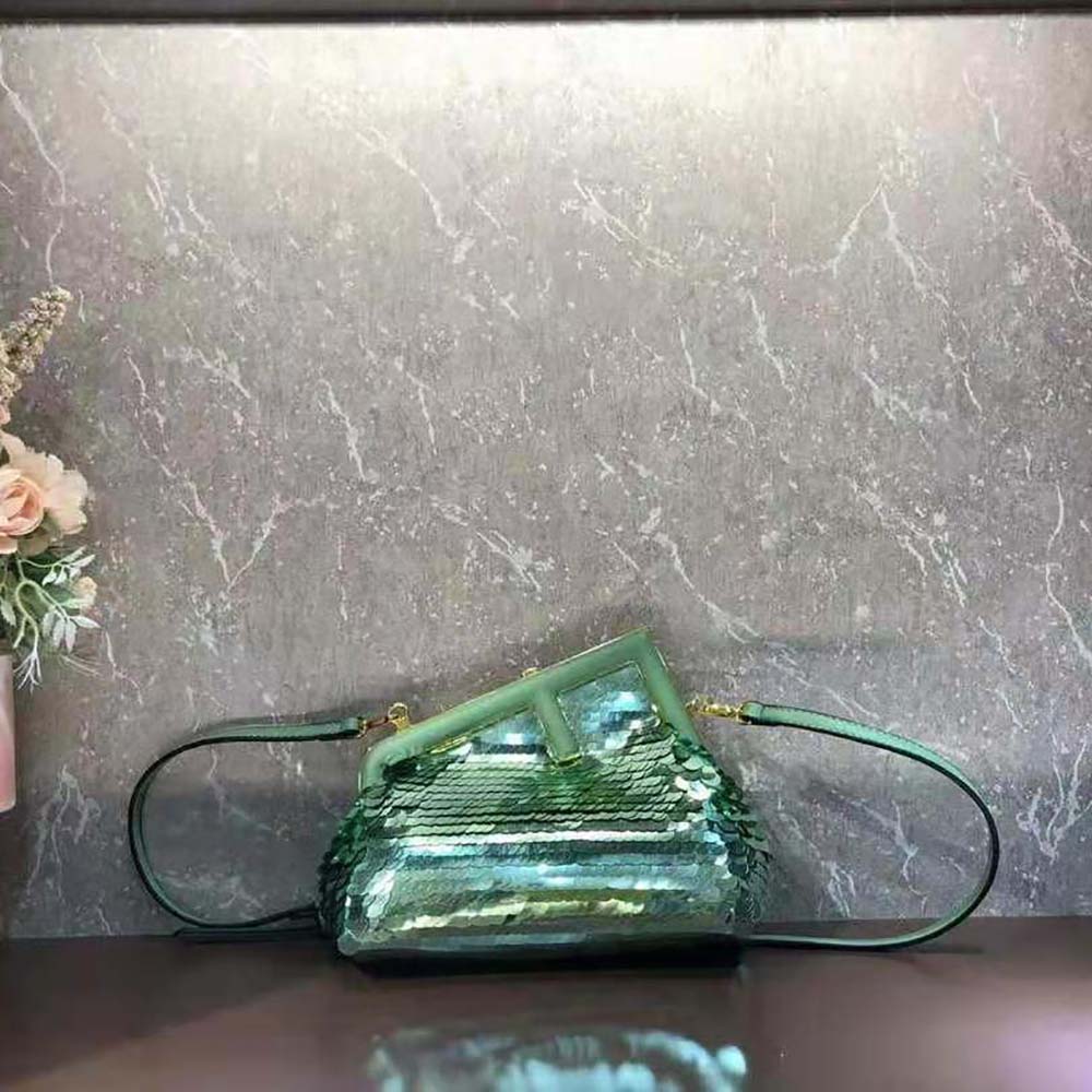 Close-up of green sequins and leather on Fendi Women First Small Bag