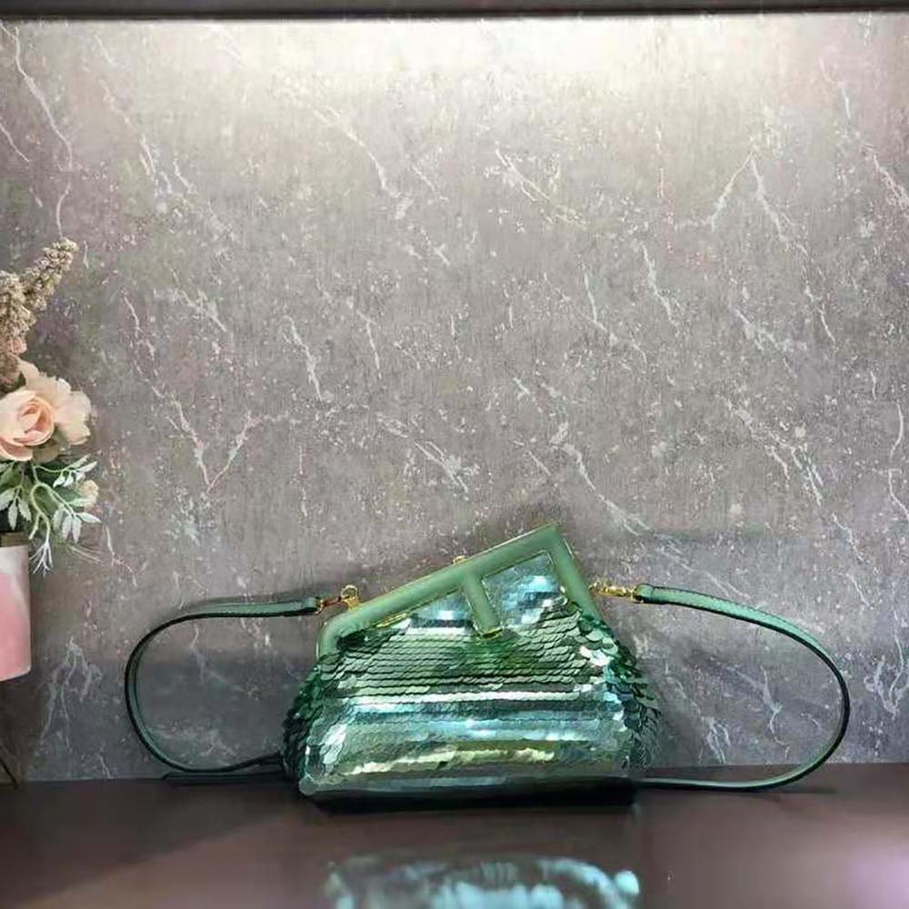 Side angle showing slim silhouette of Fendi Women First Small Green Sequinned Bag