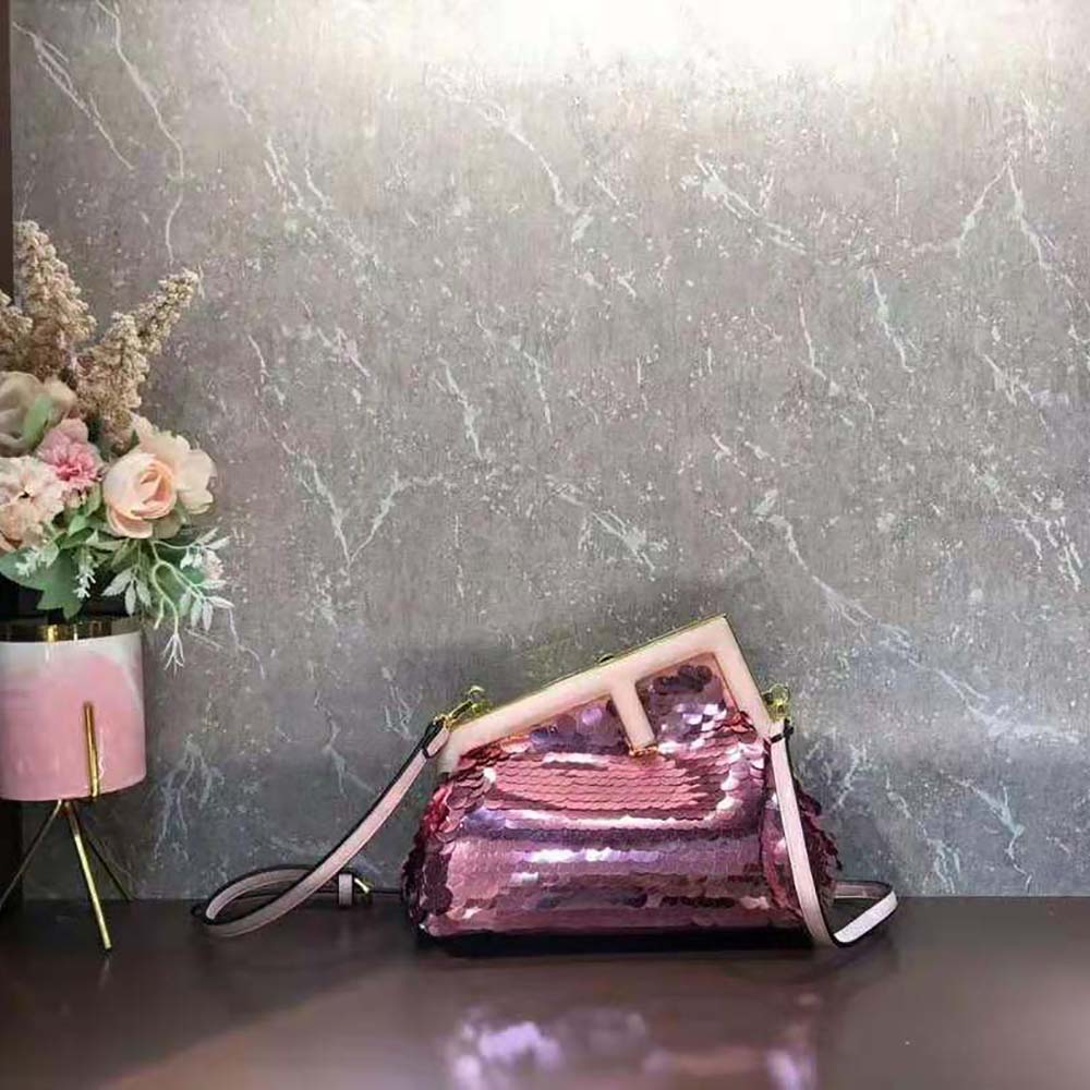 Close-up detail of pink sequins and gold hardware on Fendi Women First Bag