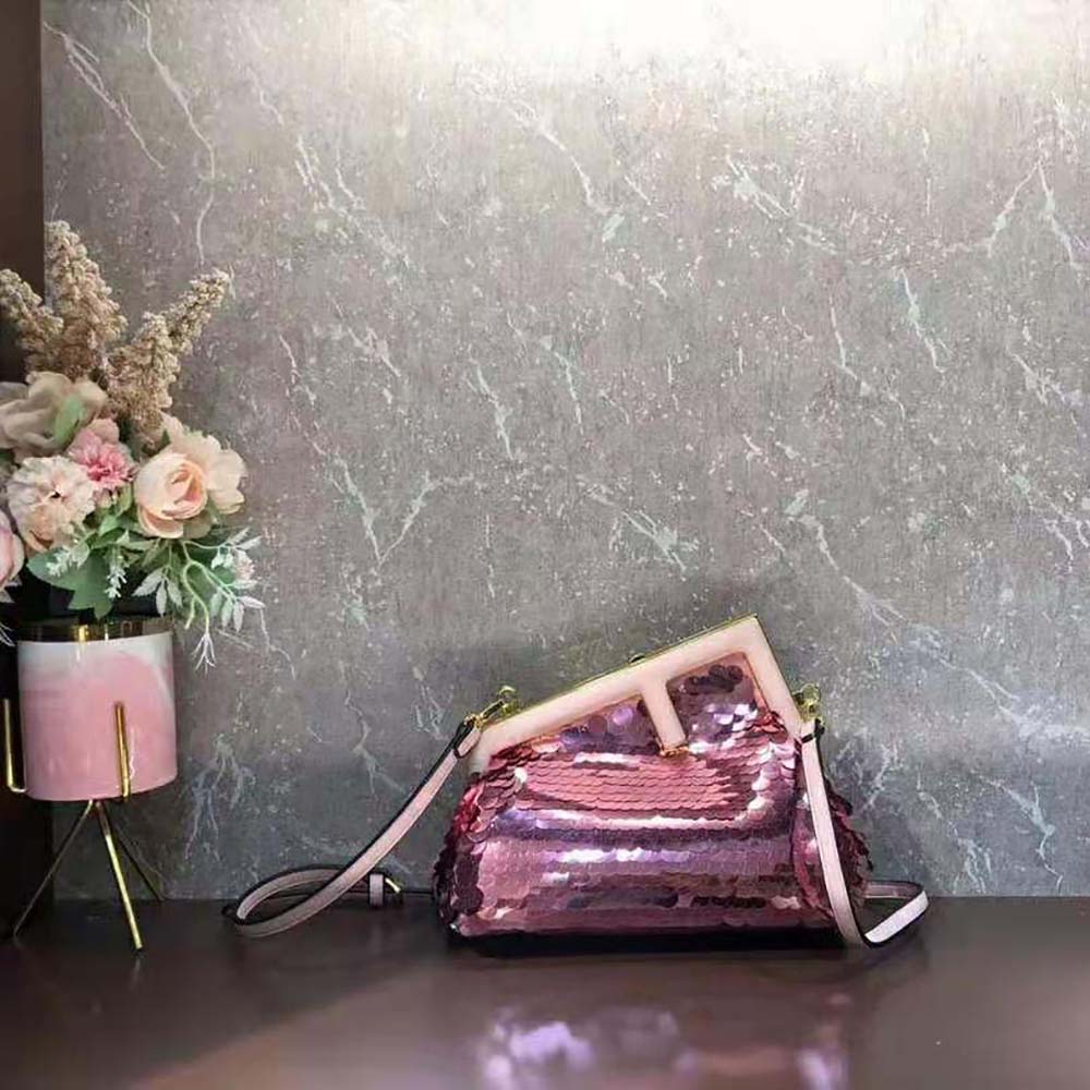Side angle showing slim profile and leather trim of Fendi Women First Small Bag