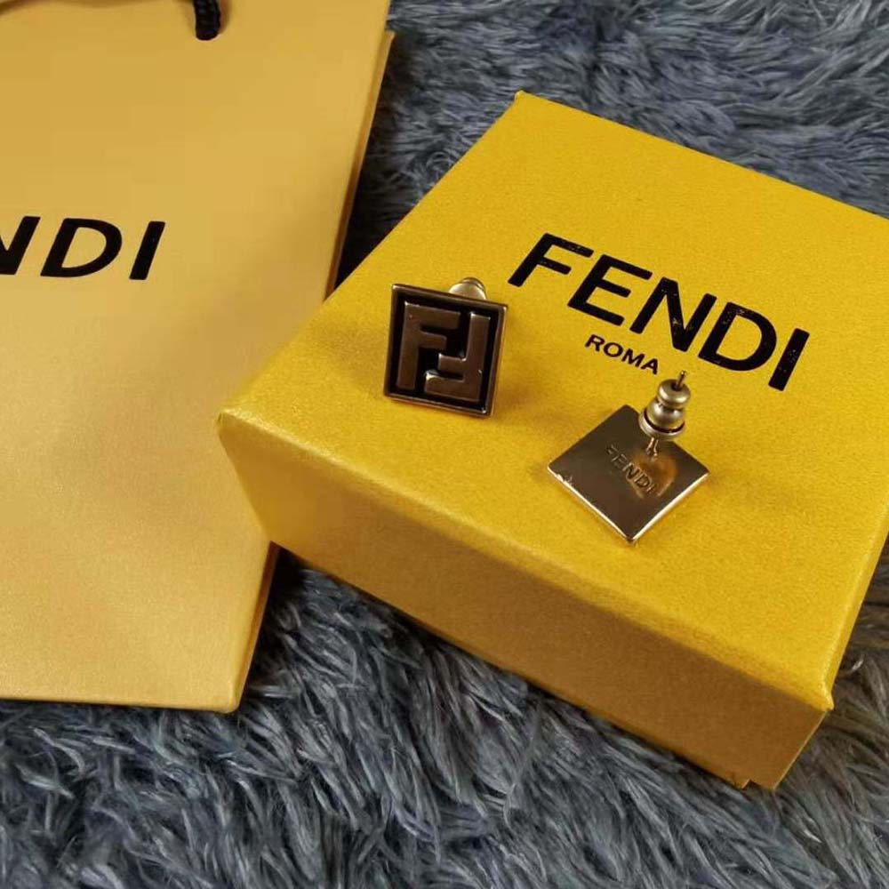 Close-up detail of gold logo hardware on Fendi Women Forever Fendi Earrings