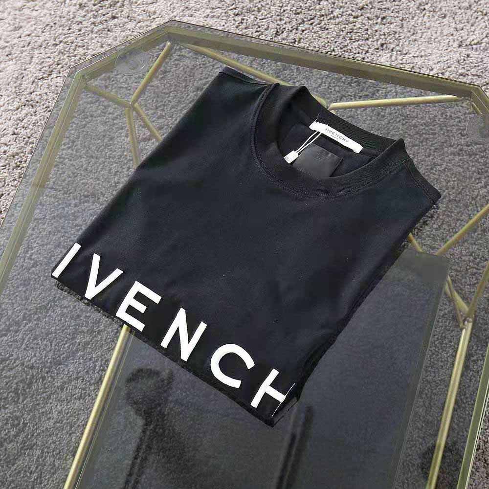 Close-up of Givenchy 4G embroidered logo on oversized black t-shirt