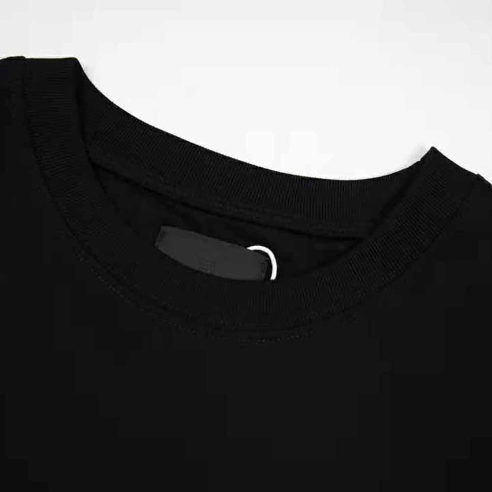 Side angle showing slim fit on Givenchy Men Slim-Fit GIVENCHY PARIS T-Shirt