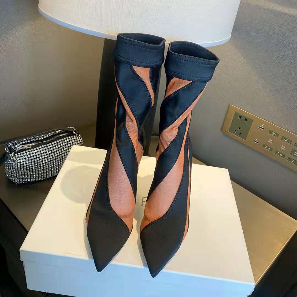 Close-up on spiral stretch fabric detail of Jimmy Choo ankle boot