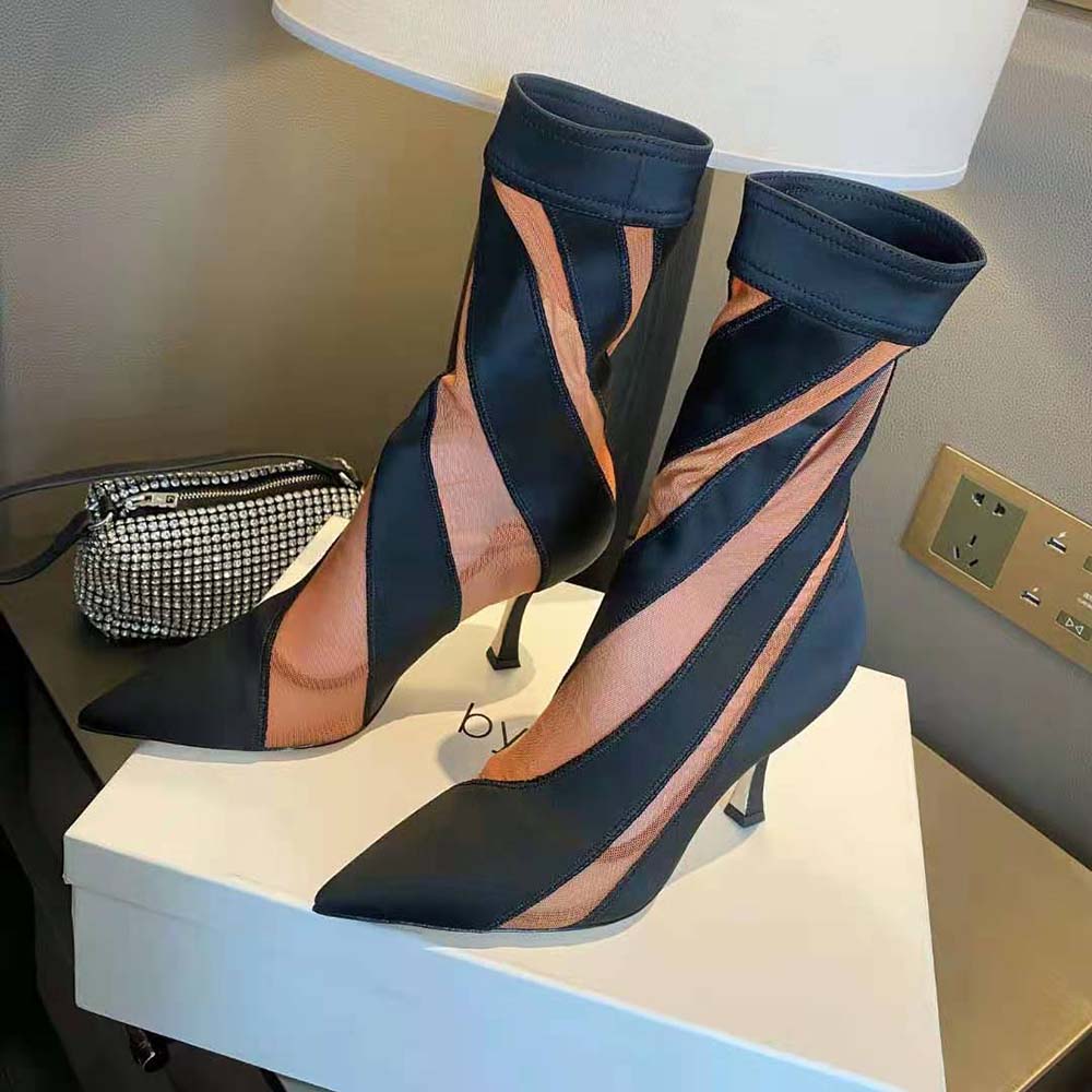 Side profile showcasing silhouette of Jimmy Choo Mugler Sock Ankle Boot