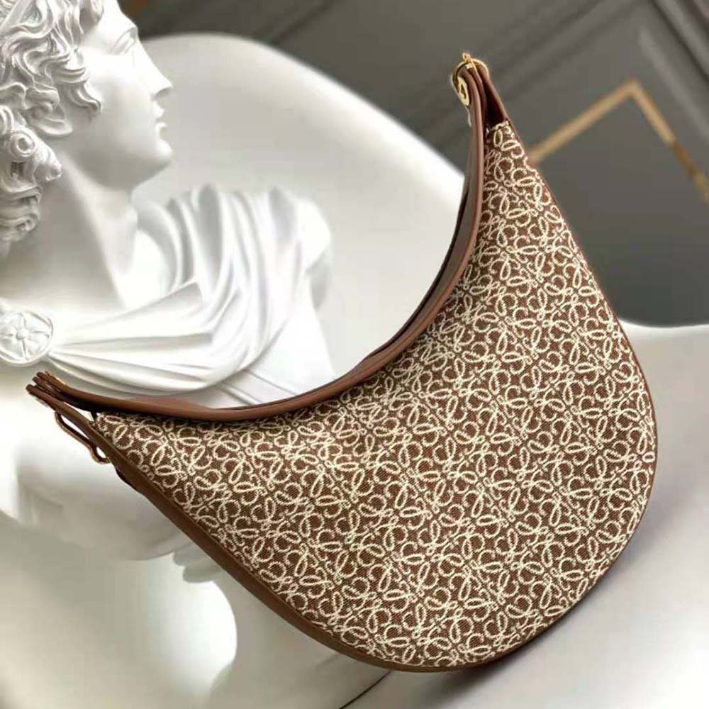 Close-up of brown calfskin leather and gold hardware on Loewe Women Luna Bag