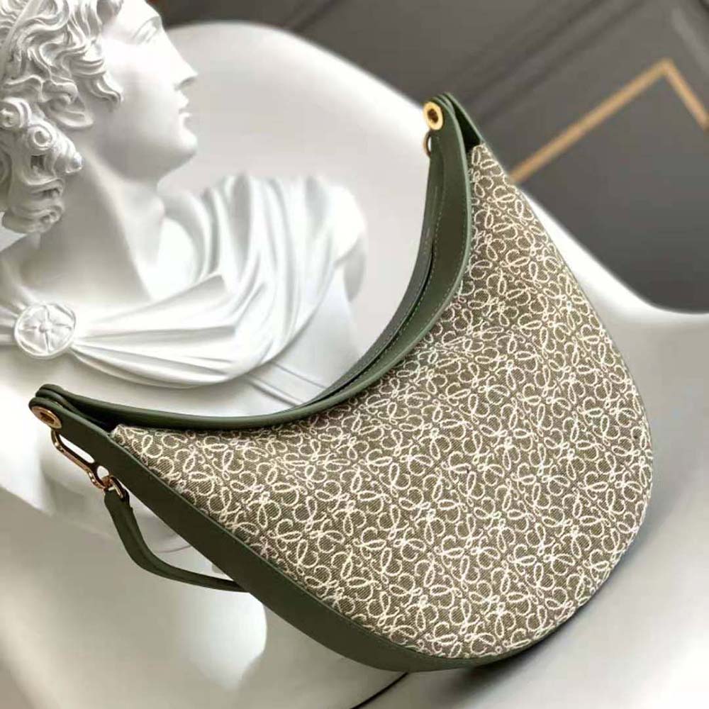 Close-up detail of calfskin leather and silver hardware on Loewe Luna Bag