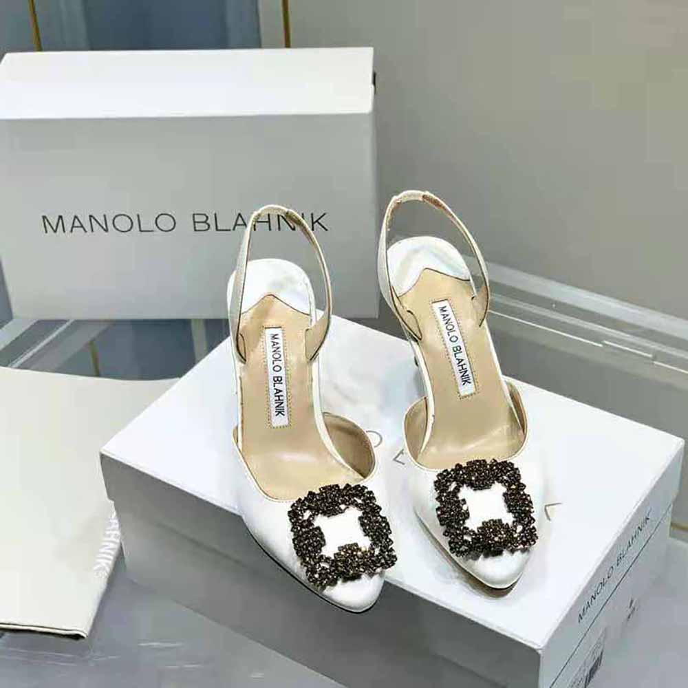 Close-up of jewel buckle detail on Manolo Blahnik cream satin slingbacks
