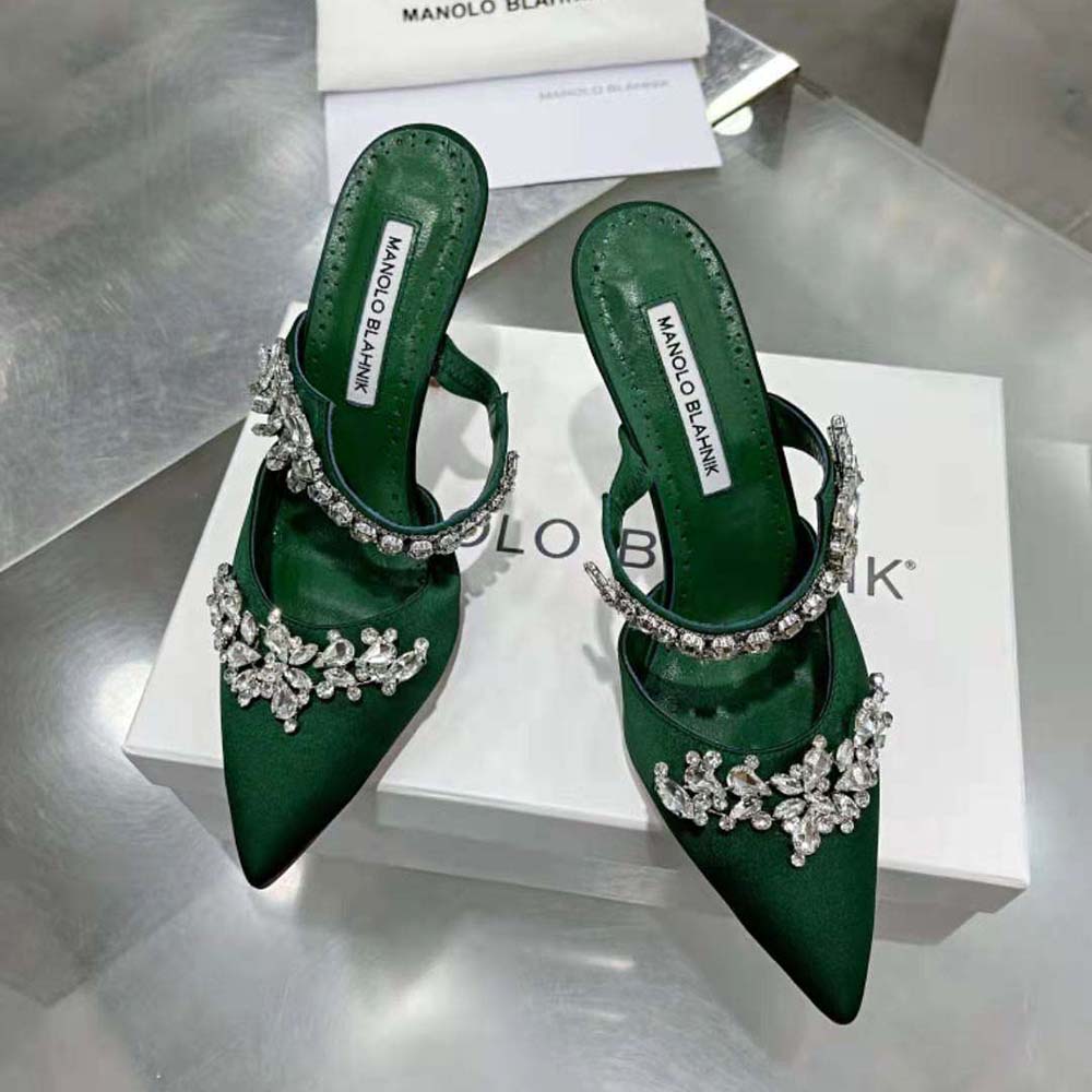 Close-up on crystal embellishments of Manolo Blahnik Green Satin Mules