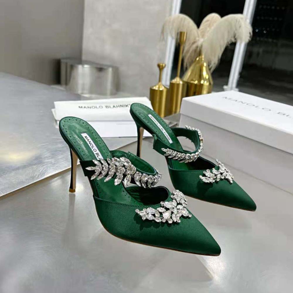 Top angle showing green satin and heel of Manolo Blahnik Crystal Mules