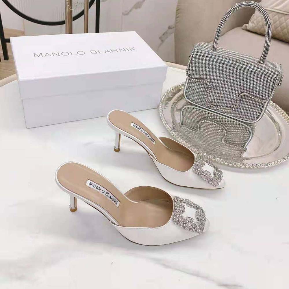 Top angle showing satin texture on Manolo Blahnik Off-White Jewel Buckle Mules