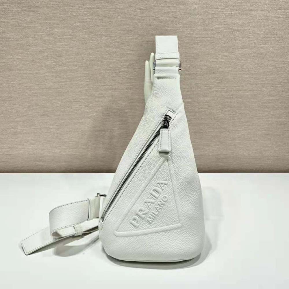 Close-up of white leather and logo-print Re-Nylon lining detail on Prada bag