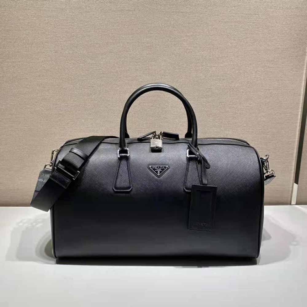 Close-up of polished silver-tone hardware and black saffiano leather detail