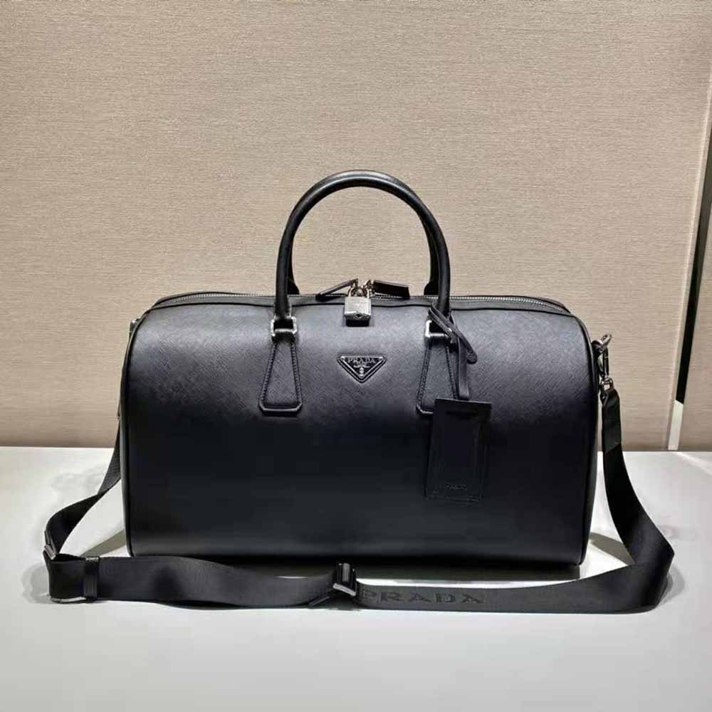 Side angle showing structured silhouette and top handles of Prada leather duffle