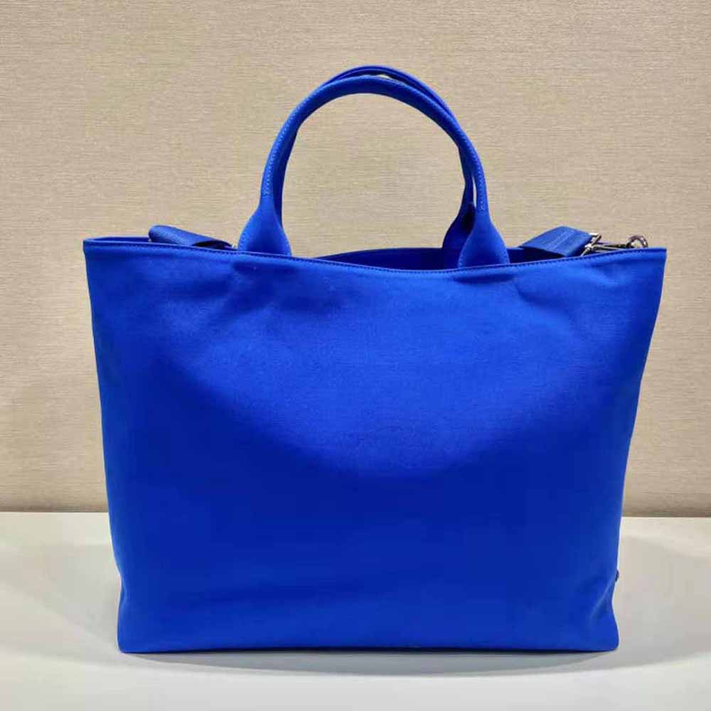 Side angle showing spacious silhouette of Prada Women Canvas Tote Bag Navy